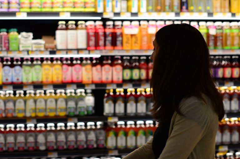 Woman walking through grocery store